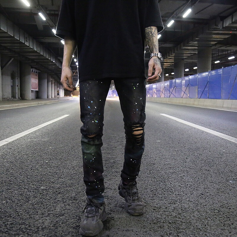 Splashed graffiti ripped stretch-leg jeans