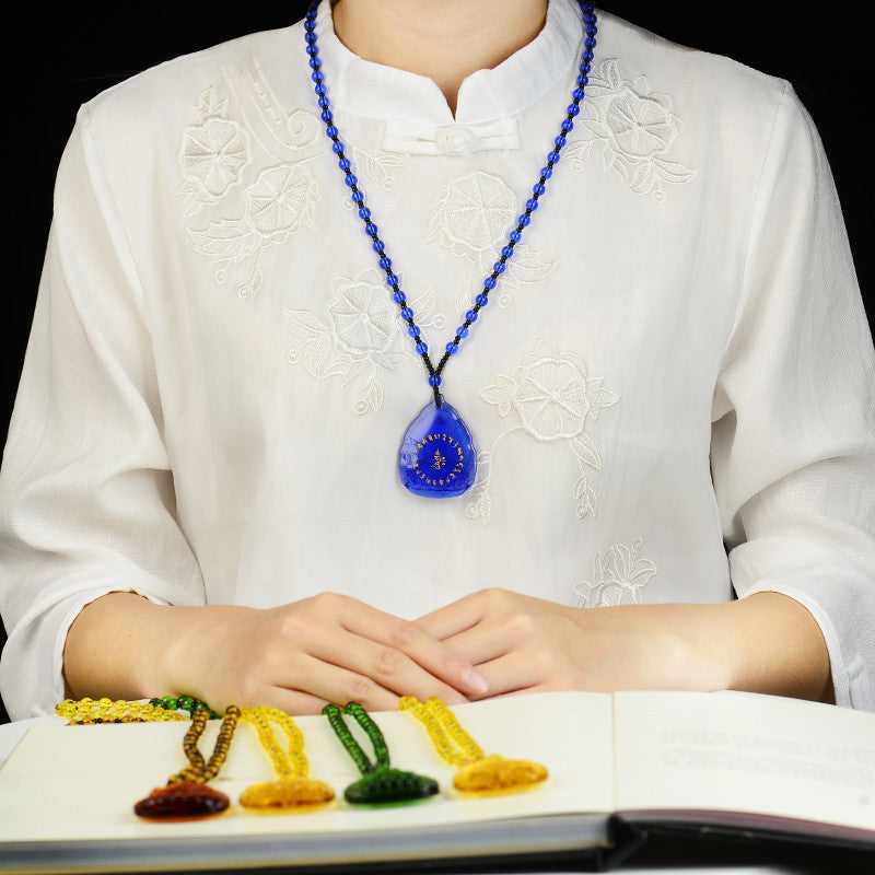 Glass pendant Buddha statue