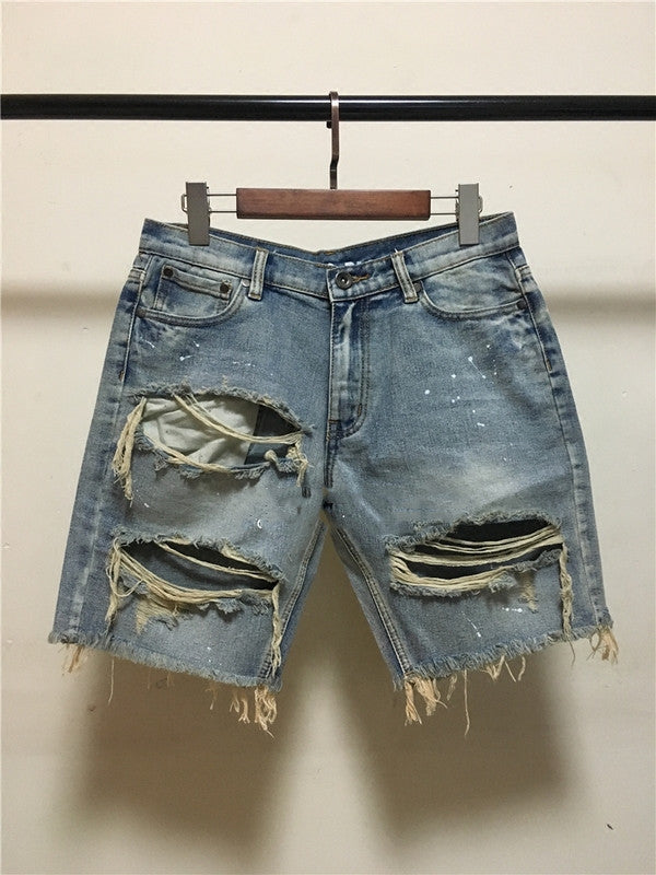 Old denim shorts with ripped paint