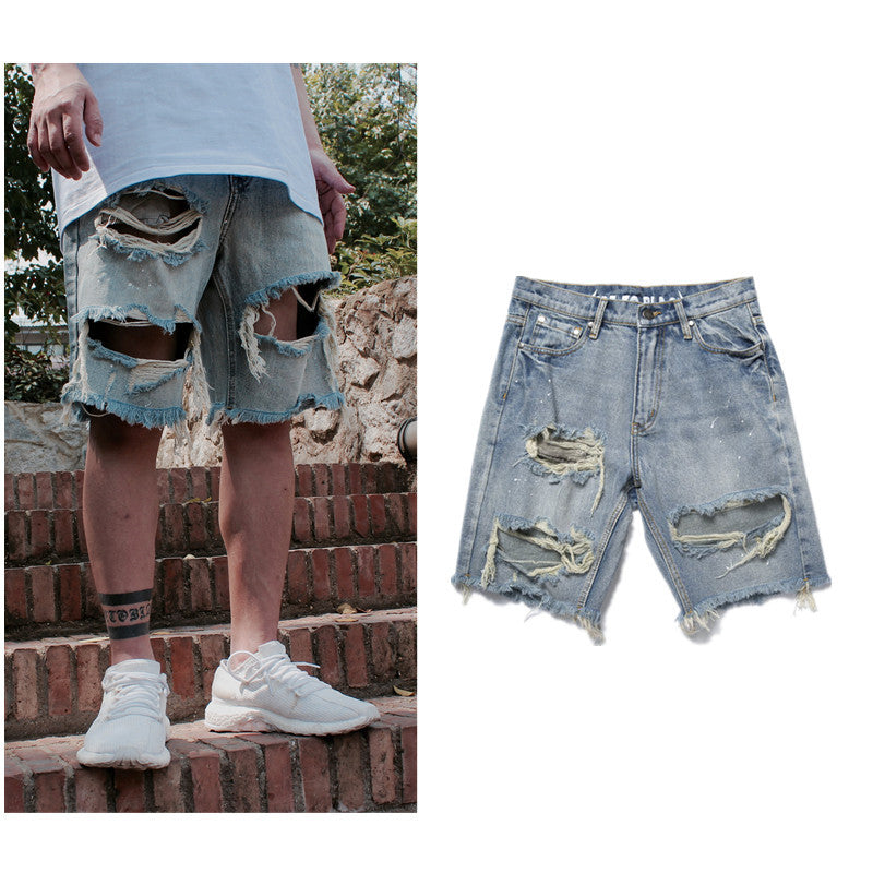 Old denim shorts with ripped paint