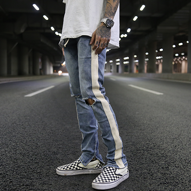 A white bar ripped zipper stretch skinny jeans