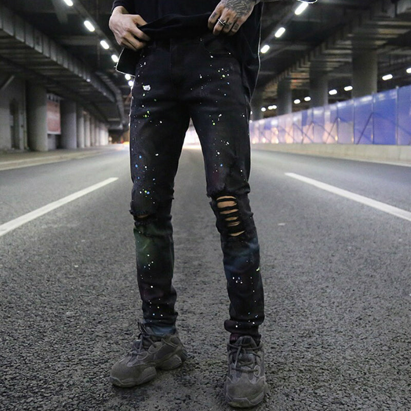 Splashed graffiti ripped stretch-leg jeans