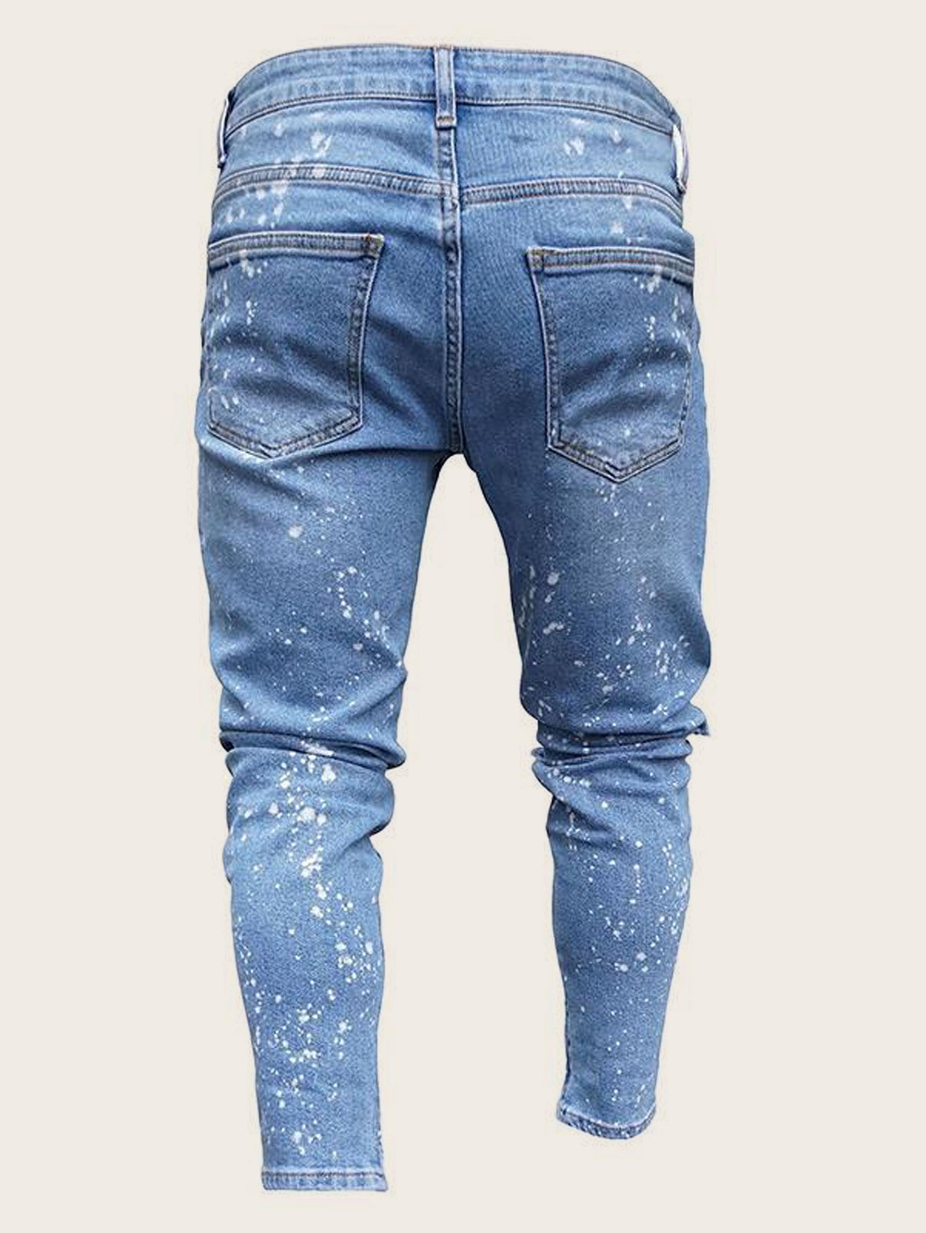 Washed jeans with small zipper holes