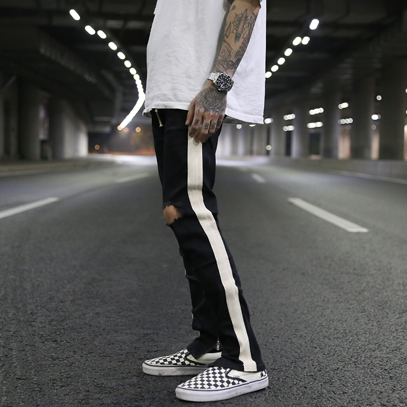 A white bar ripped zipper stretch skinny jeans