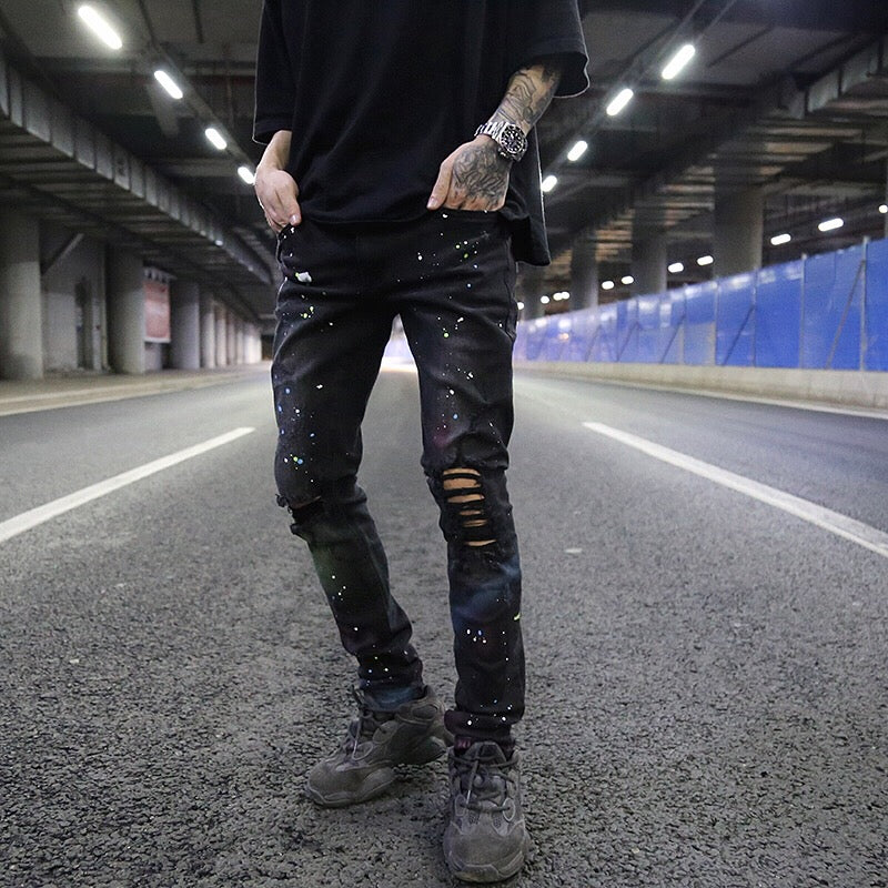 Splashed graffiti ripped stretch-leg jeans