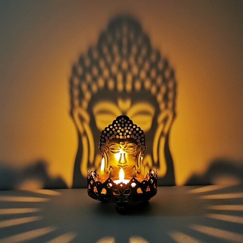 Art Buddha Candlestick Butter Oil Lamp Buddha Sitting on Lotus Feature Art Hollow Metal Candle Holder Carving Light and Shadow