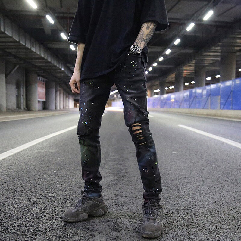 Splashed graffiti ripped stretch-leg jeans