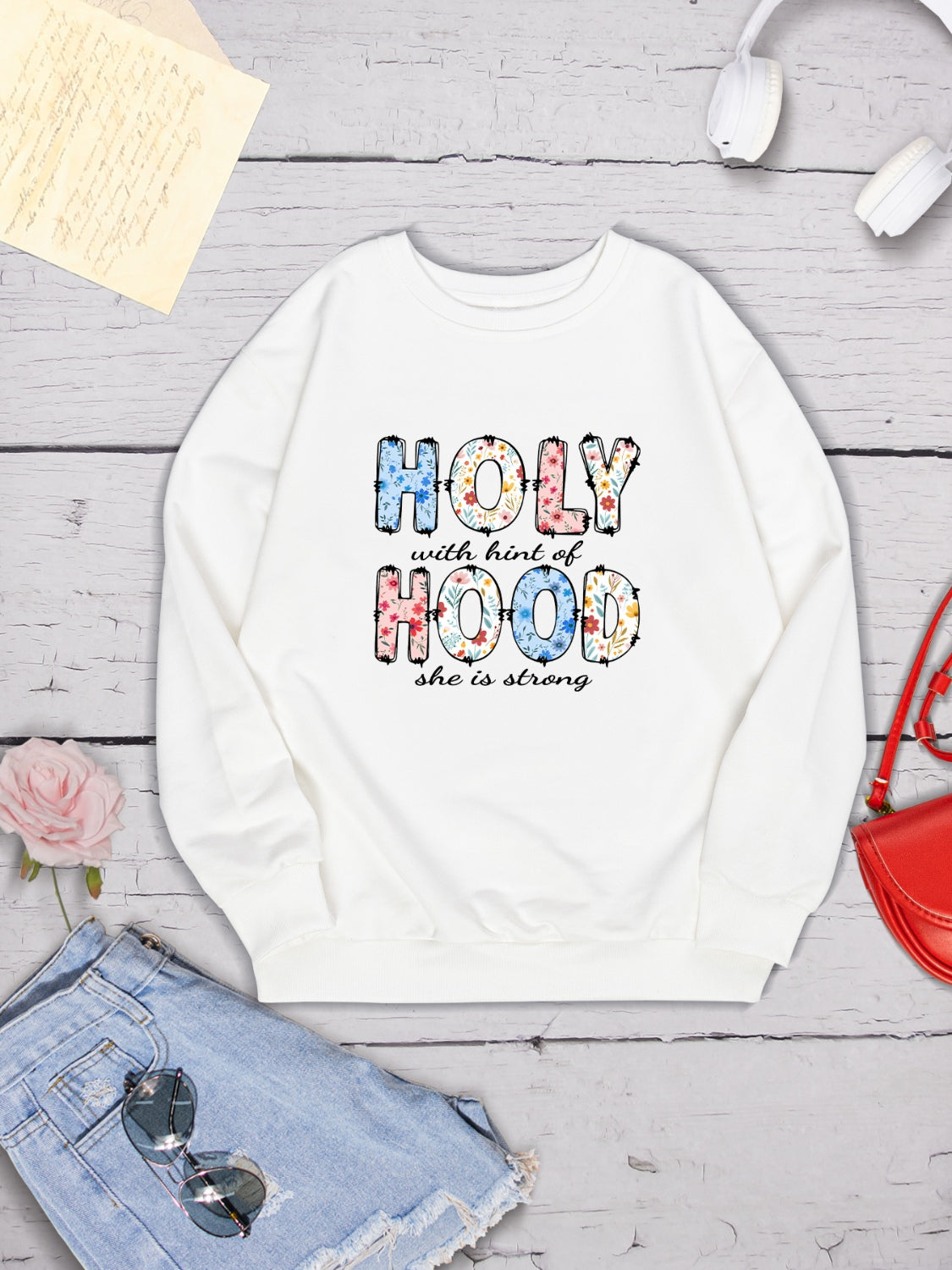 HOLY WITH HINT OF HOOD SHE IS STRONG Round Neck Sweatshirt 