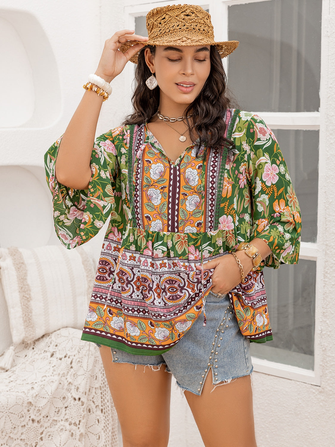 Plus Size Printed Tie Neck Peplum Blouse 